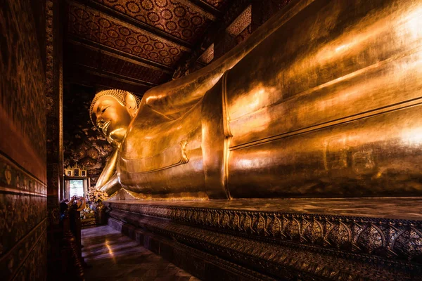 famous golden reclining buddha statue at wat pho bangkok thailan