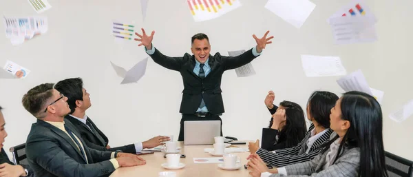 business background of executive management show exiting and happy of business success by throwing paper to air in business meeting with businesspeople in meeting room