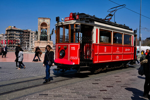  Nostalgic Red Tram in Taksim Istiklal Street at noon. Taksim Istiklal Street is a popular destination in Istanbul. Beyoglu, Taksim, Istanbul. Turkey.