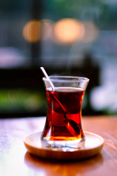 Traditional Turkish Two Tea on Wooden Table. Traditional Turkish Tea blur  background. Turkish Tea bokeh background.