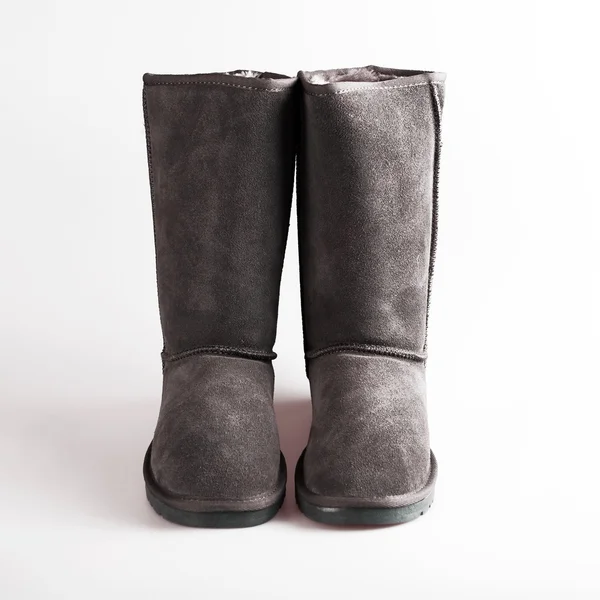 Vrouwelijke grijze laarzen over Wit — Stockfoto