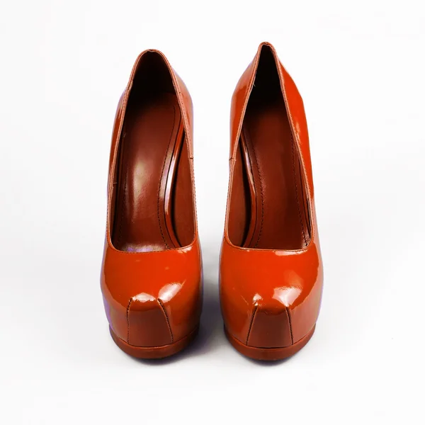 Female orange shoes over white — Stock Photo, Image