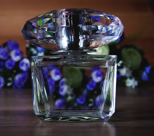 Perfume with blue flowers — Stock Photo, Image