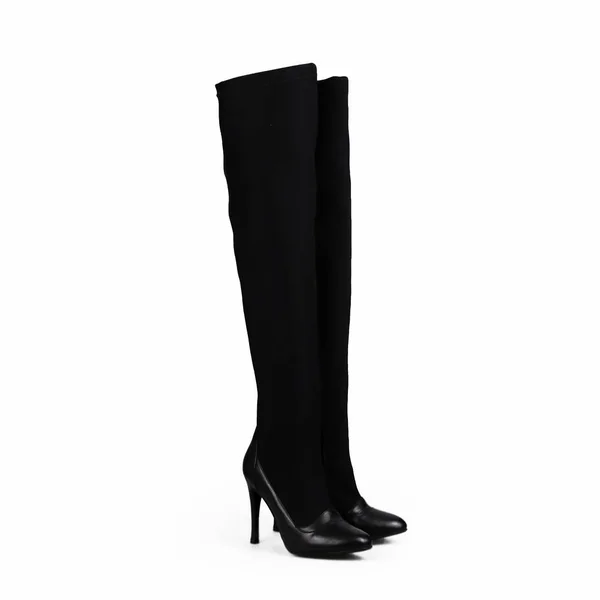 Vrouwelijke zwarte laarzen over Wit — Stockfoto