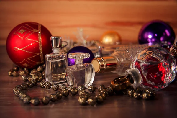 Perfume and Christmas decorations — Stock Photo, Image