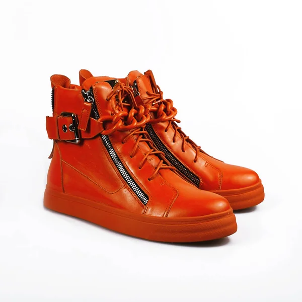 Female orange boots over white — Stock Photo, Image