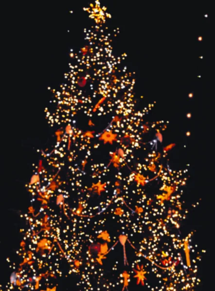 Blurred Christmas lights on a Christmas tree — Stock Photo, Image