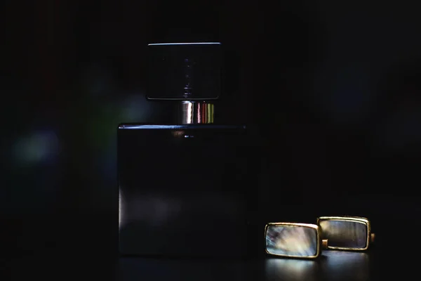 Male perfume with cufflinks — Stock Photo, Image