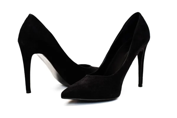 Черные туфли на высоких каблуках поверх белых — стоковое фото