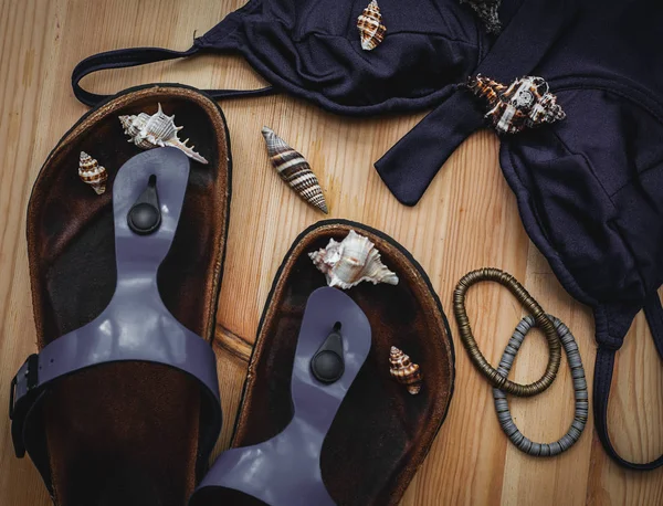 Blue swimsuit and beach slippers — Stock Photo, Image