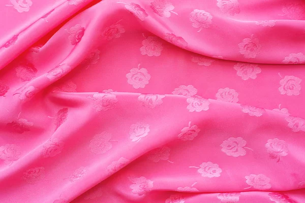 缎纹织物色泽鲜艳粉红色是波为背景 — 图库照片