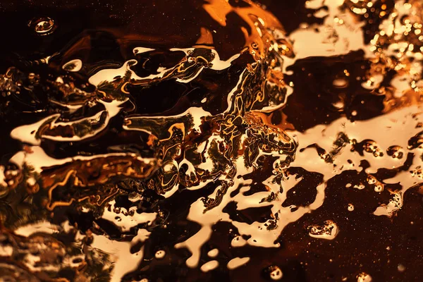 Liquid gold background. Abstract gold water waves with reflectio