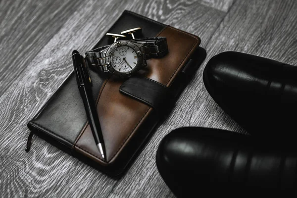 male accessories. Shoes with watch and notepad