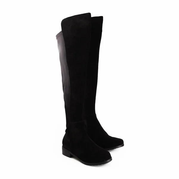 Bottes noires femelles hautes sur fond blanc — Photo