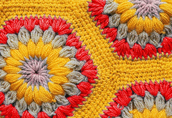 Knitted textile carpet pattern macro.