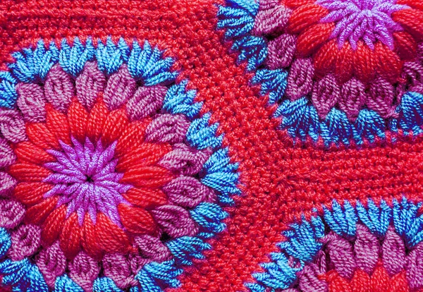 Knitted textile carpet pattern macro.