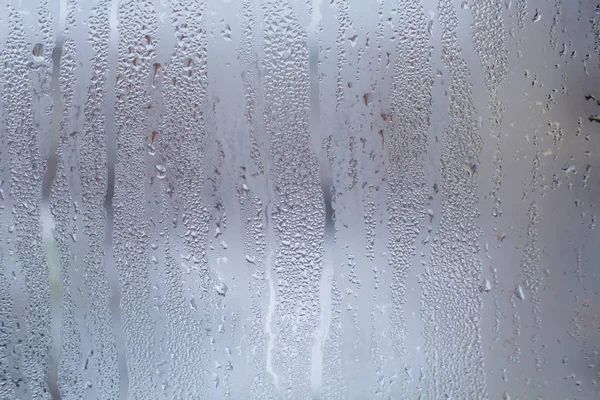 Misted window glass in drops of water as a background — Stock Photo, Image