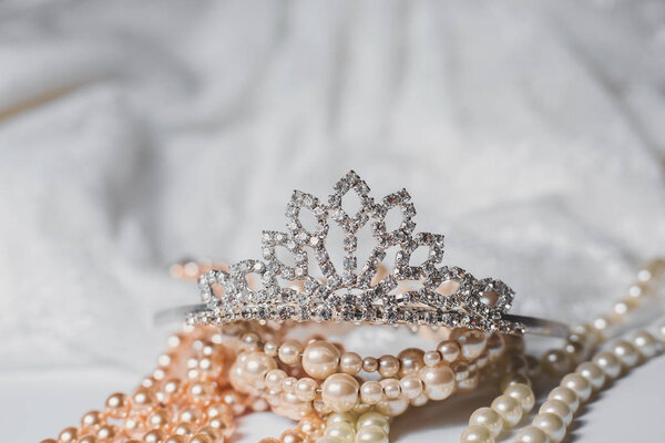 Tiara and pearls with wedding dress