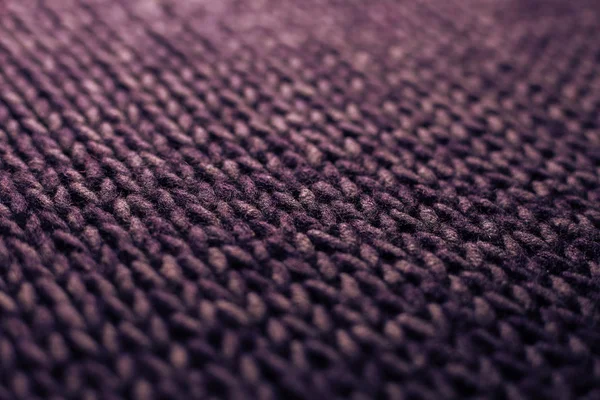Winter Sweater Design. Purple knitting wool texture background