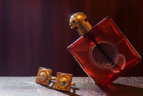 Male perfume with cuff on dark background — Stock Photo, Image