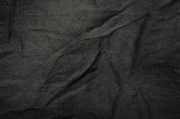 Schwarzer synthetischer Stoff Stoff Textur Detail Hintergrund — Stockfoto