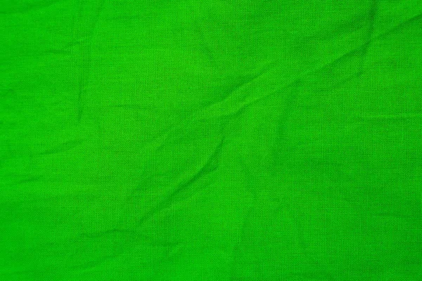 Green texture of a piece of crumpled material — Stock Photo, Image
