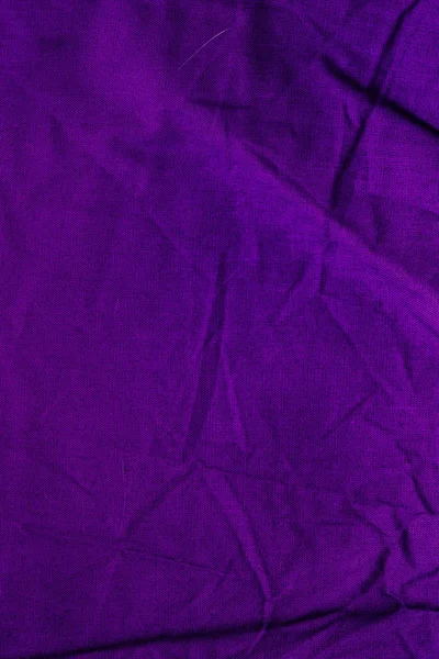 Close up of old dirty wrinkled purple bedsheet texric texture ba — стоковое фото