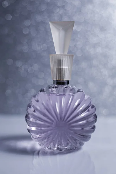 Perfume bottle on grey background — Stock Photo, Image