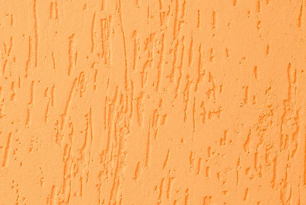 Стена покрыта декоративной желтой шпаклевкой — стоковое фото