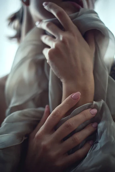 Female hands and light silk fabric — 图库照片