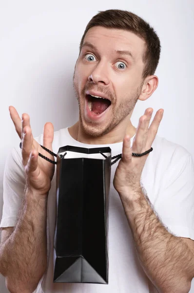 Happy Guy Holds Package Gift — Stock Photo, Image