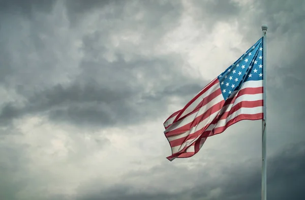 American flag on a dark cloudy — Stock Photo, Image