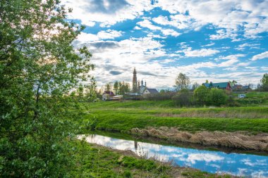 Panorama of the village of Mikhailovskoye in the rays of the set