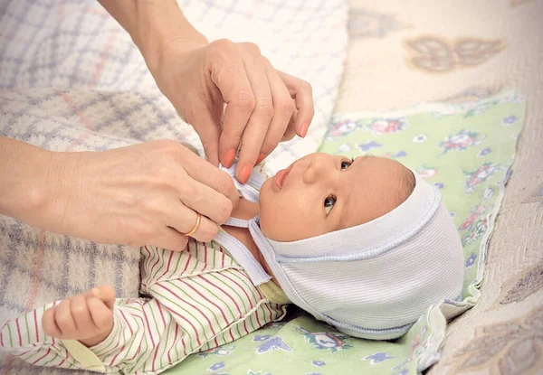 Mom Caring Hands Put Hat Baby — Stock Photo, Image