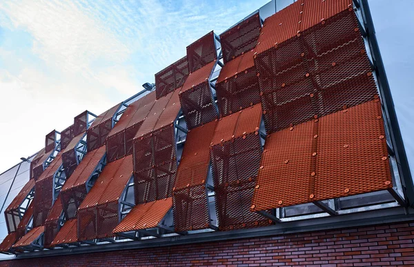 The glass roof of the building in the form of different-sized squares.