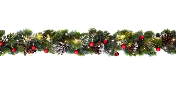 Karácsonyfa koszorú díszített piros baubles és fényes fények, ünnepi koncepció banner Stock Kép