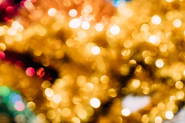 Colorful led lights golden festive bokeh, blurred