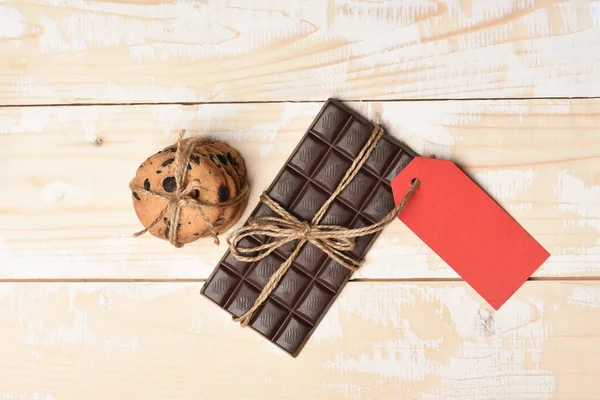 Dark chocolate bar with oatmeal cookies — Stock Photo, Image