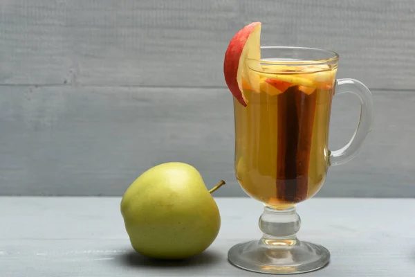 Glass of delicious glintwein with apple — Stock Photo, Image