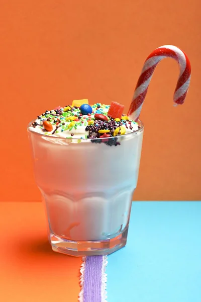 Milk shake with colorful candies — Stock Photo, Image