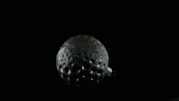 Silver ball on black background — Stock Video