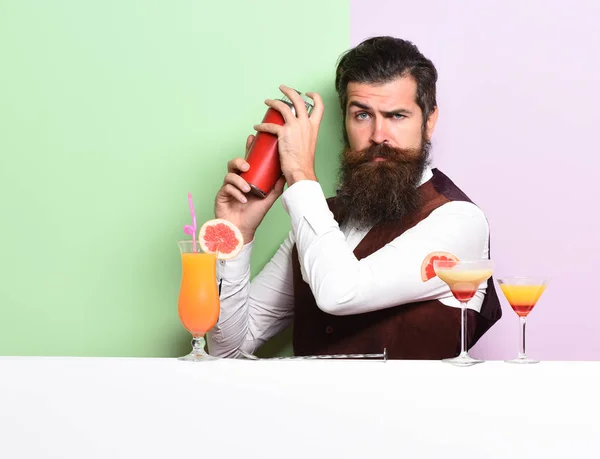 serious handsome bearded barman