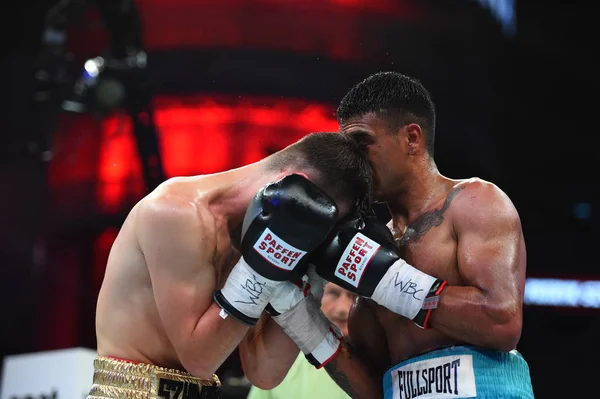 An unidentified boxers in the ring during fight for ranking points — Stock Photo, Image