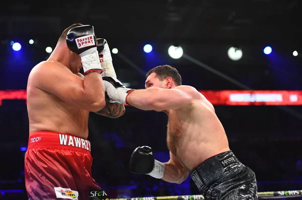 An unidentified boxers in the ring during fight for ranking points — Stock Photo, Image