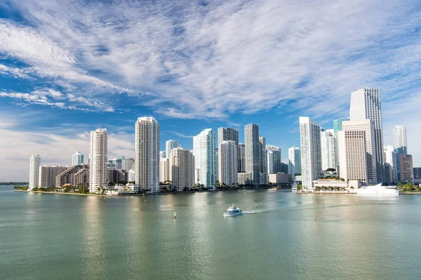 Aerial view of Miami skyscrapers with blue cloudy sky, boat sail — Stock Photo, Image