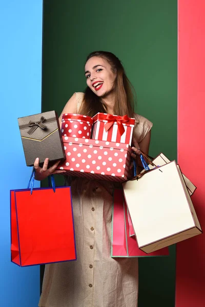 Happy colorful girl with bags — Stock Photo, Image