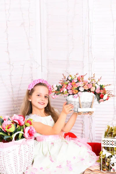 Cute blonde girl with flowers — Stock Photo, Image