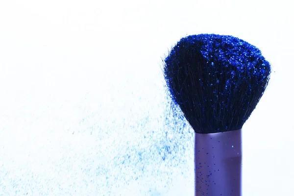 Soft cosmetics brush with blue glister — Stock Photo, Image