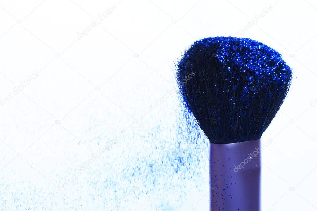 soft cosmetics brush with blue glister