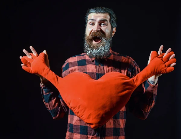 Bearded man with heart pillow — Stock Photo, Image